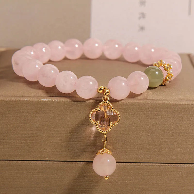 Pink crystal four-leaf clover pendant women's bracelet with alloy inlay and rhinestone details