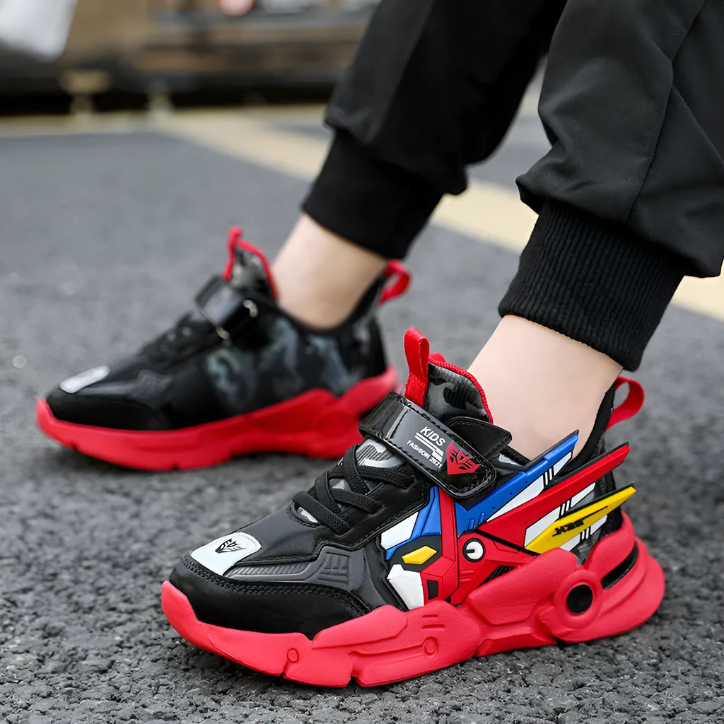Boy's yellow artificial leather running shoes with Velcro strap and cartoon pattern, shown on a rubber sole.