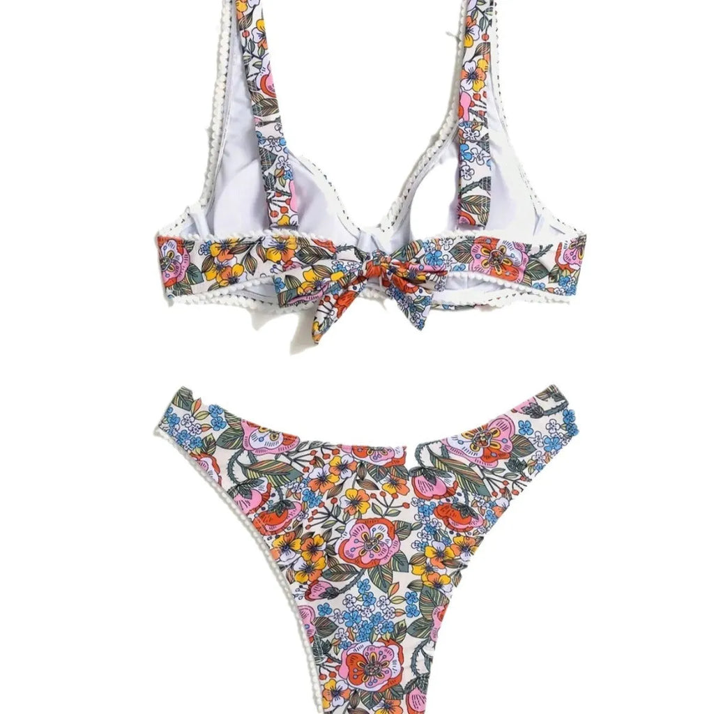 Women's floral print bikini with steel bracket push-up and tied sides, shown in high-waist briefs style.