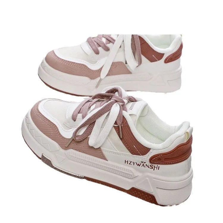 Children's beige board shoes with thick rubber soles, cross shoulder straps, and lace-up front.