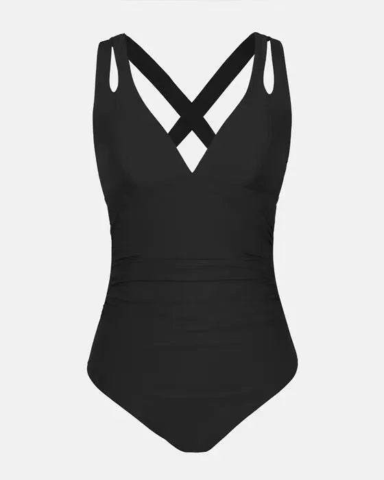 Women's solid colour one-piece swimsuit with bikini triangle top and cross shoulder straps.