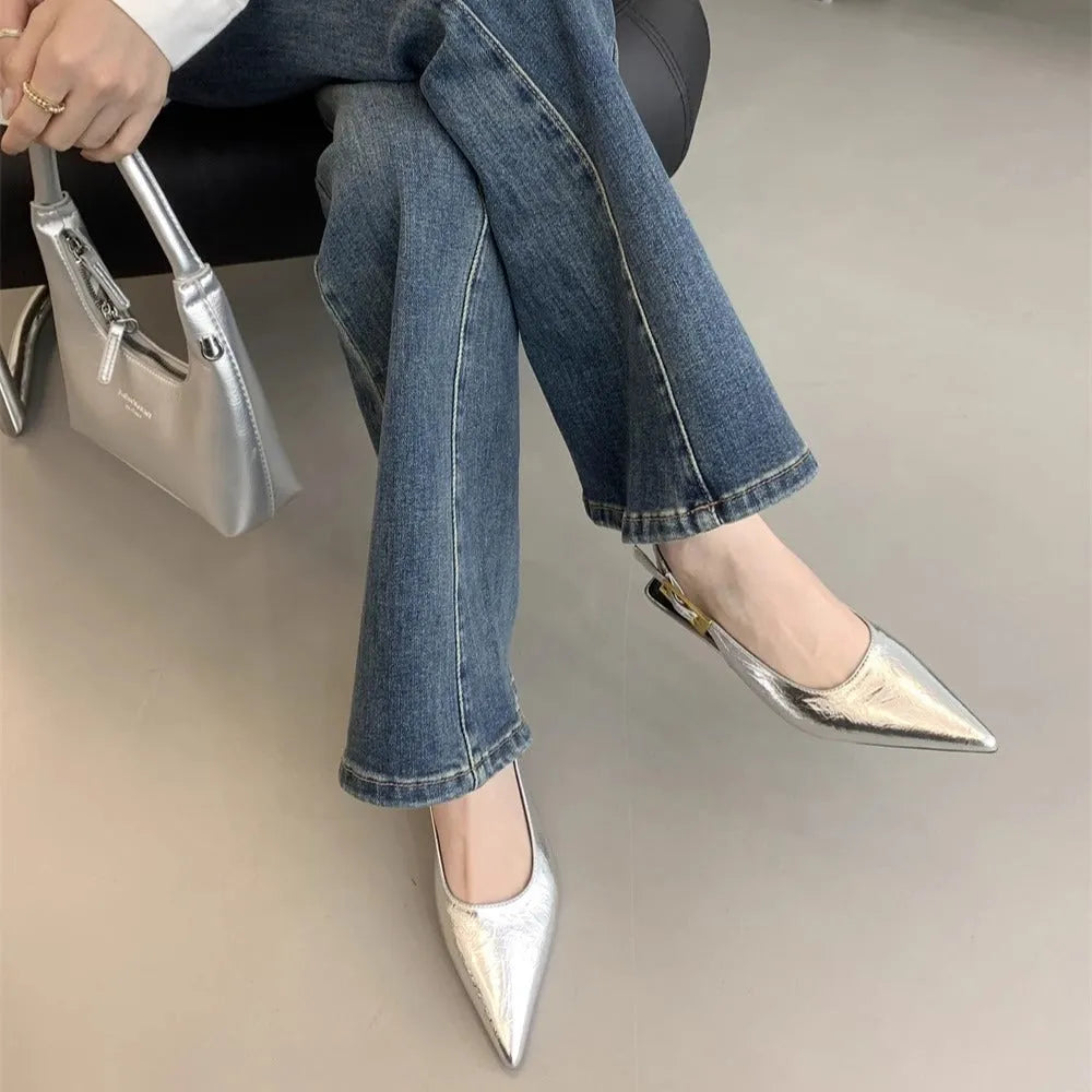 Women's black leather low heel strap shoes with pointed toe and thin rubber soles