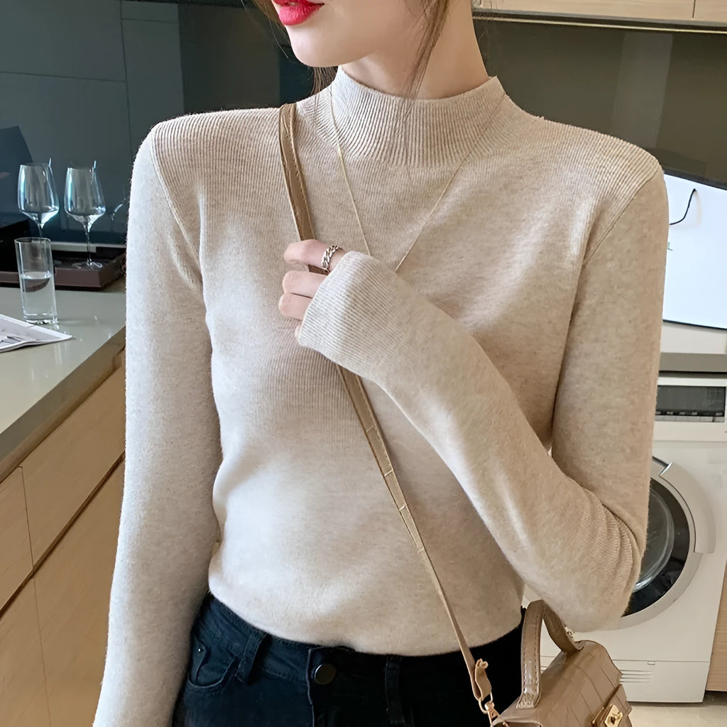 Slim fit long sleeve viscose top in apricot colour on a hanger