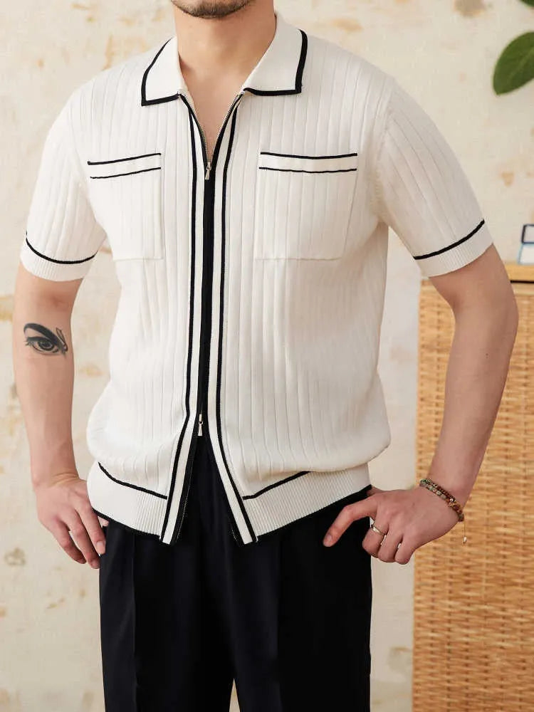 Slim fit black knitted polo shirt with a lapel collar and short sleeves on a hanger.