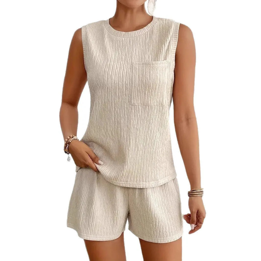 Women's apricot polyester sleeveless vest and matching shorts set laid flat.