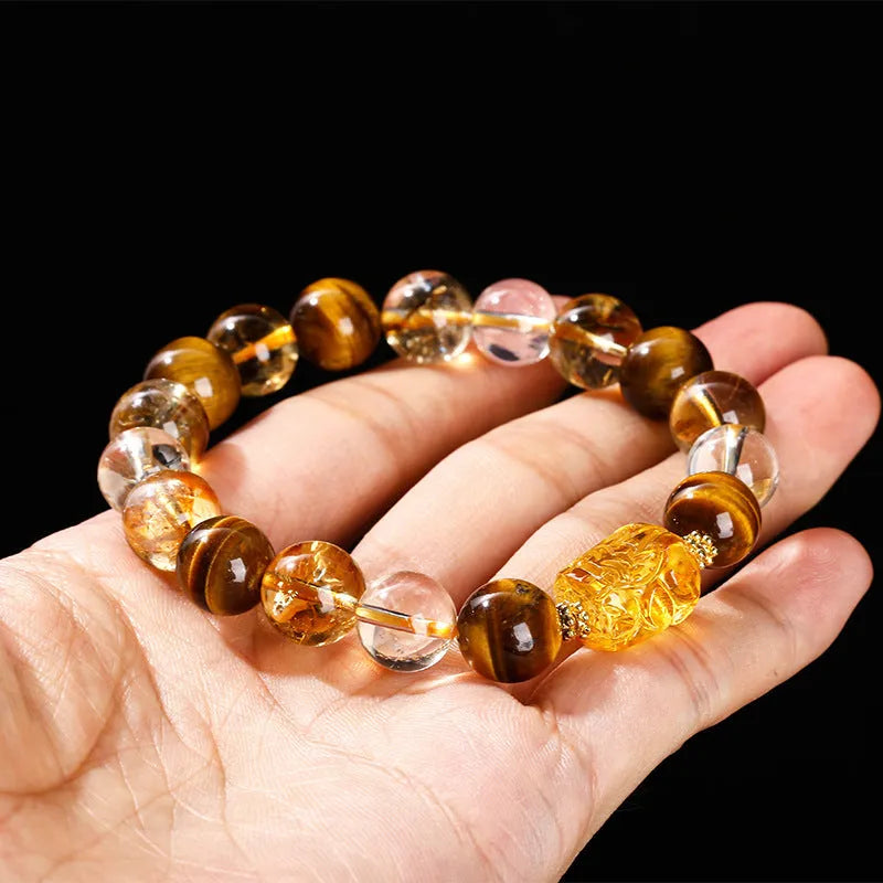 Natural yellow tiger's eye and citrine gemstone bracelet with 10mm beads and a steel Pi Xiu charm.