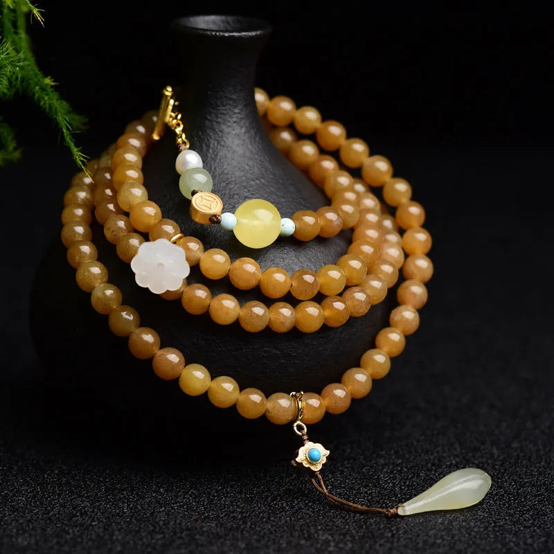 Women's green jade bead bracelet with leaf motifs and sequin details
