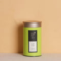 Metal tea packaging box tin can in green colour with sealed lid showing dimensions