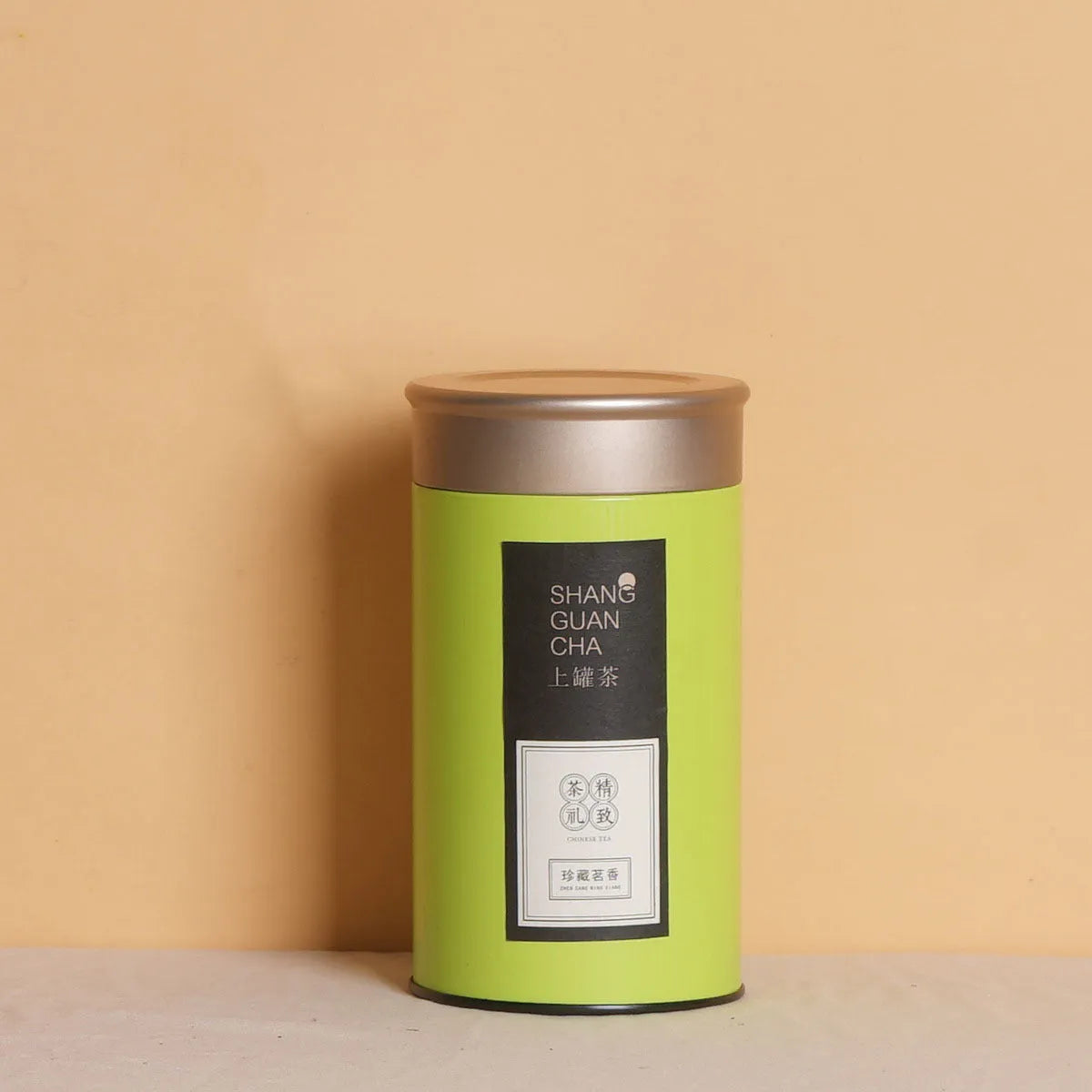 Metal tea packaging box tin can in green colour with sealed lid showing dimensions