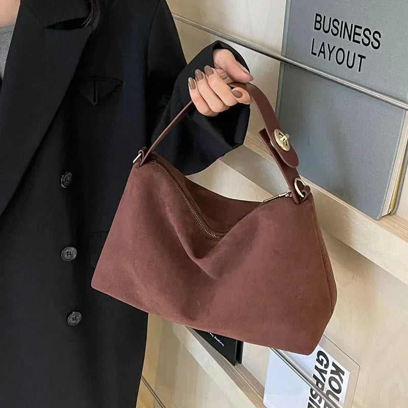 Retro frosted suede underarm handbag in black, brown or coffee with single strap, lock and stitching details.