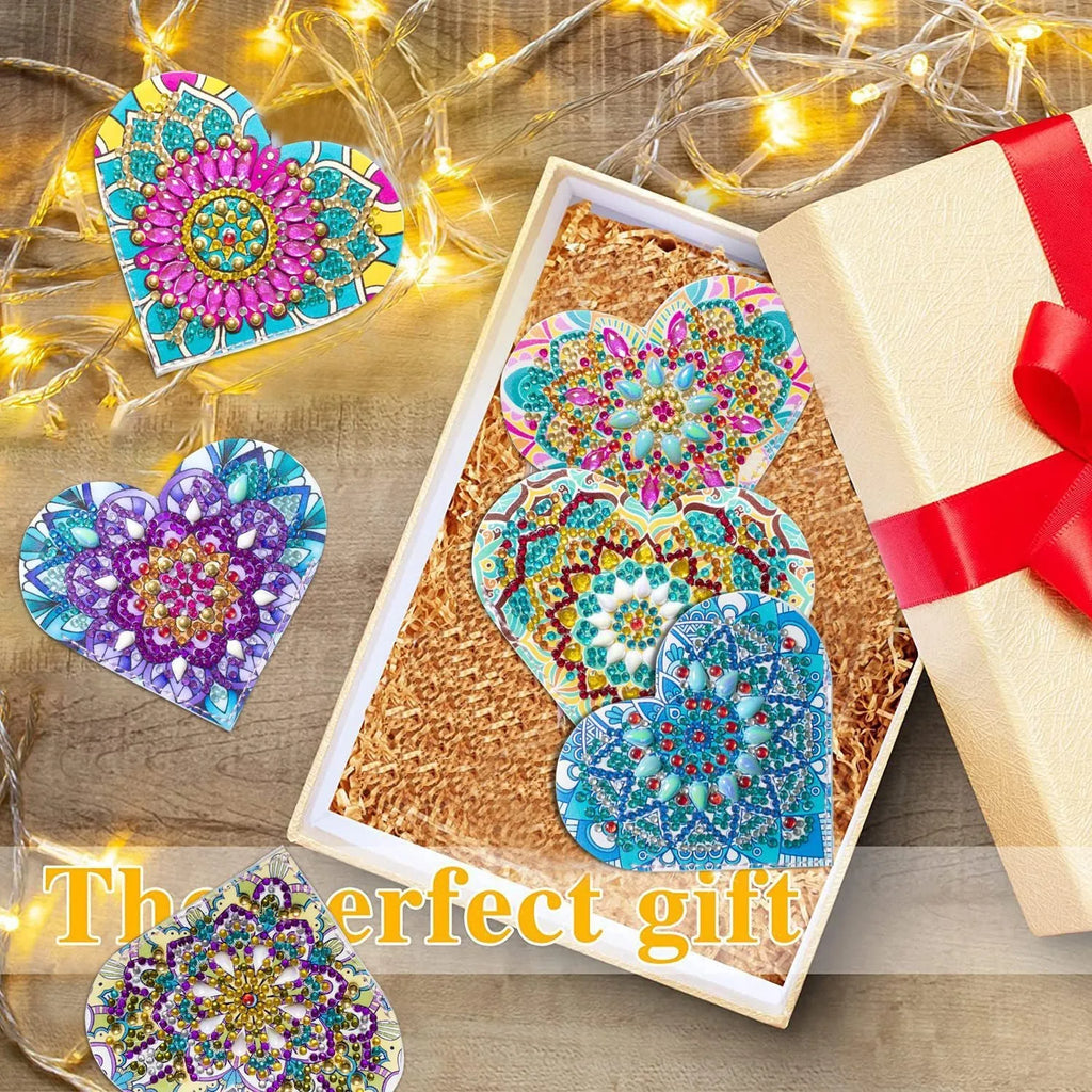 Set of six handmade PU leather flower cornerite bookmarks with stick-on crystals on a surface.