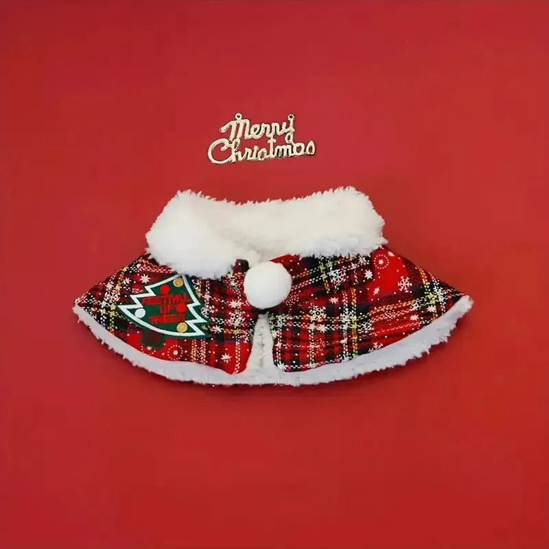 Red festive pet scarf with bell design on a dog, showing the polyester material and cloak-style fit.