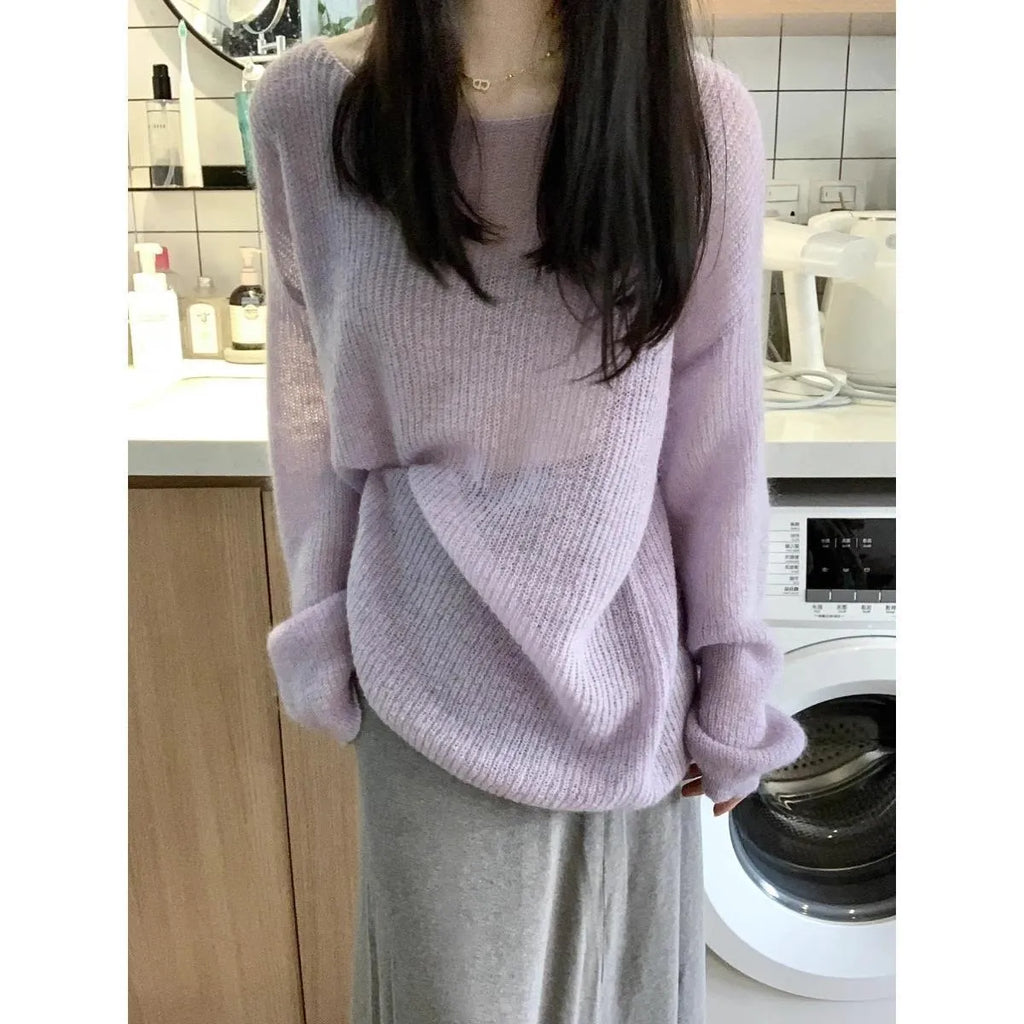 Purple sleeveless women's blouse with princess sleeves and a shoulder strap detail.