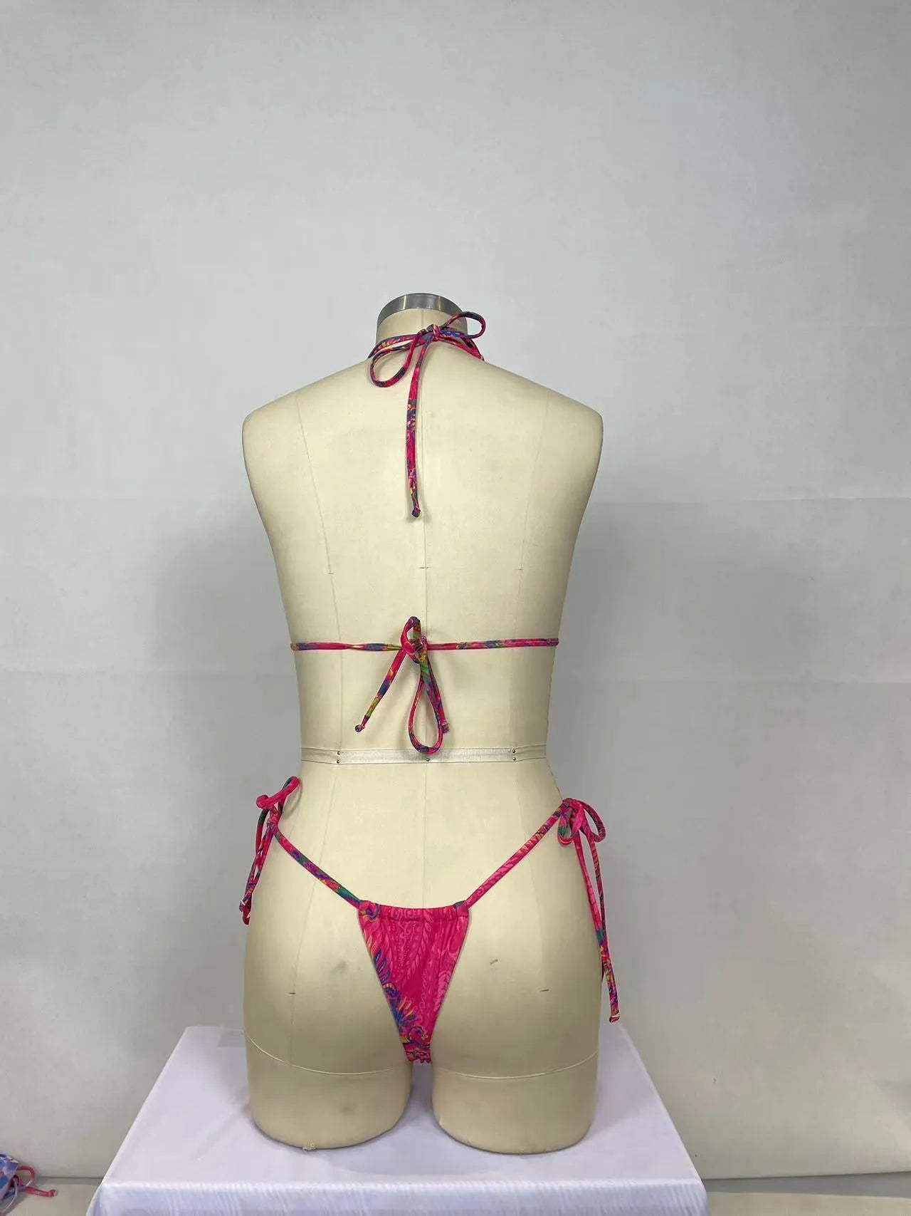 Women's pink printed nylon bikini two-piece set showing front and back views