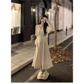 Women's knitted V-neck dress with princess sleeves and long skirt in Milky White or Black.