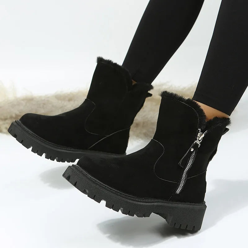 Women's black faux suede high-top snow boots with side zip and thick faux fur lining visible at the ankle.