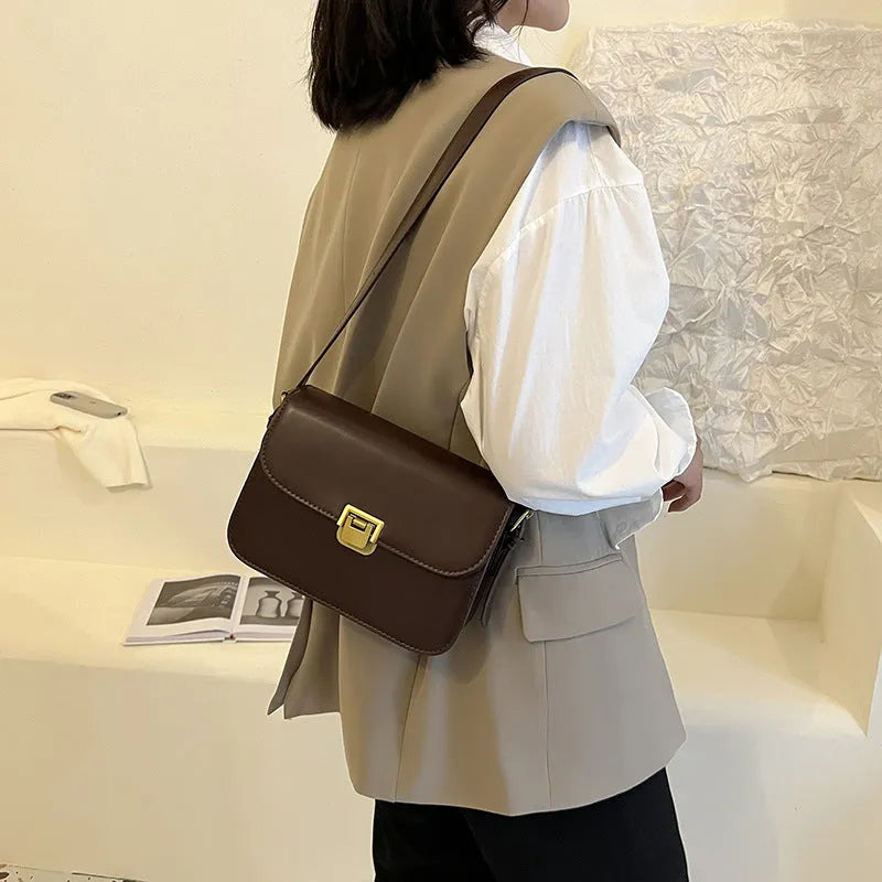Women's soft PU leather cross-body bag in horizontal square shape showing texture detail and colour options
