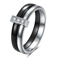 Geometric ceramic women's ring with zirconium inlay and glossy stitching in steel black.