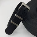 Nylon integrated watch strap in army green colour showing textile weave and buckle.