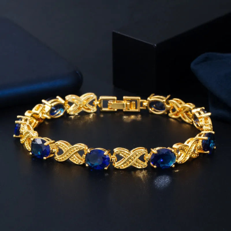 Women's gold plated copper zircon bracelet, 18cm with 3cm extender, in blue, green, red or white