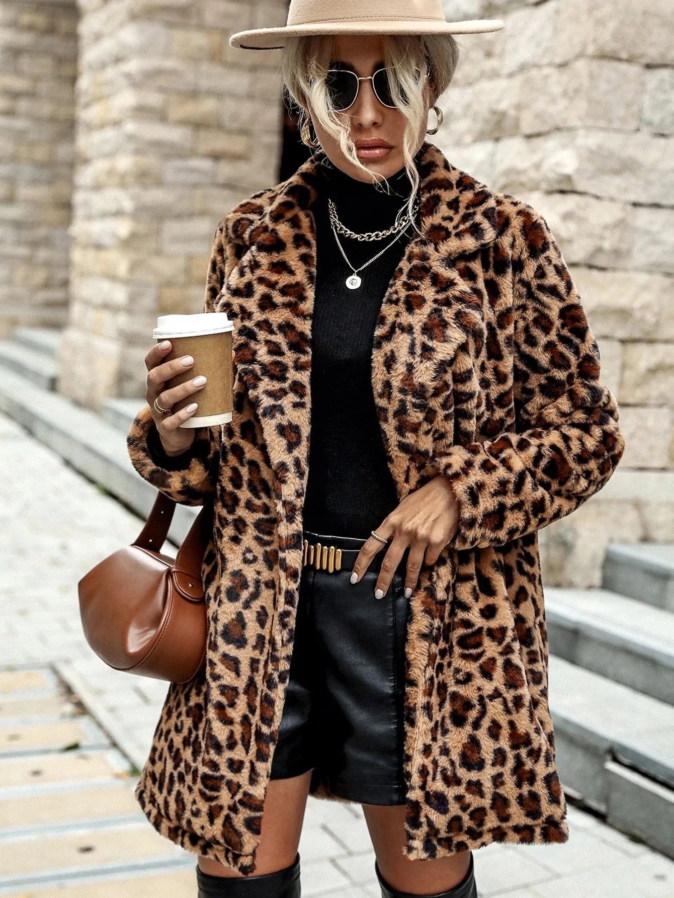 Leopard print long sleeve furry coat top with animal pattern on a plain background
