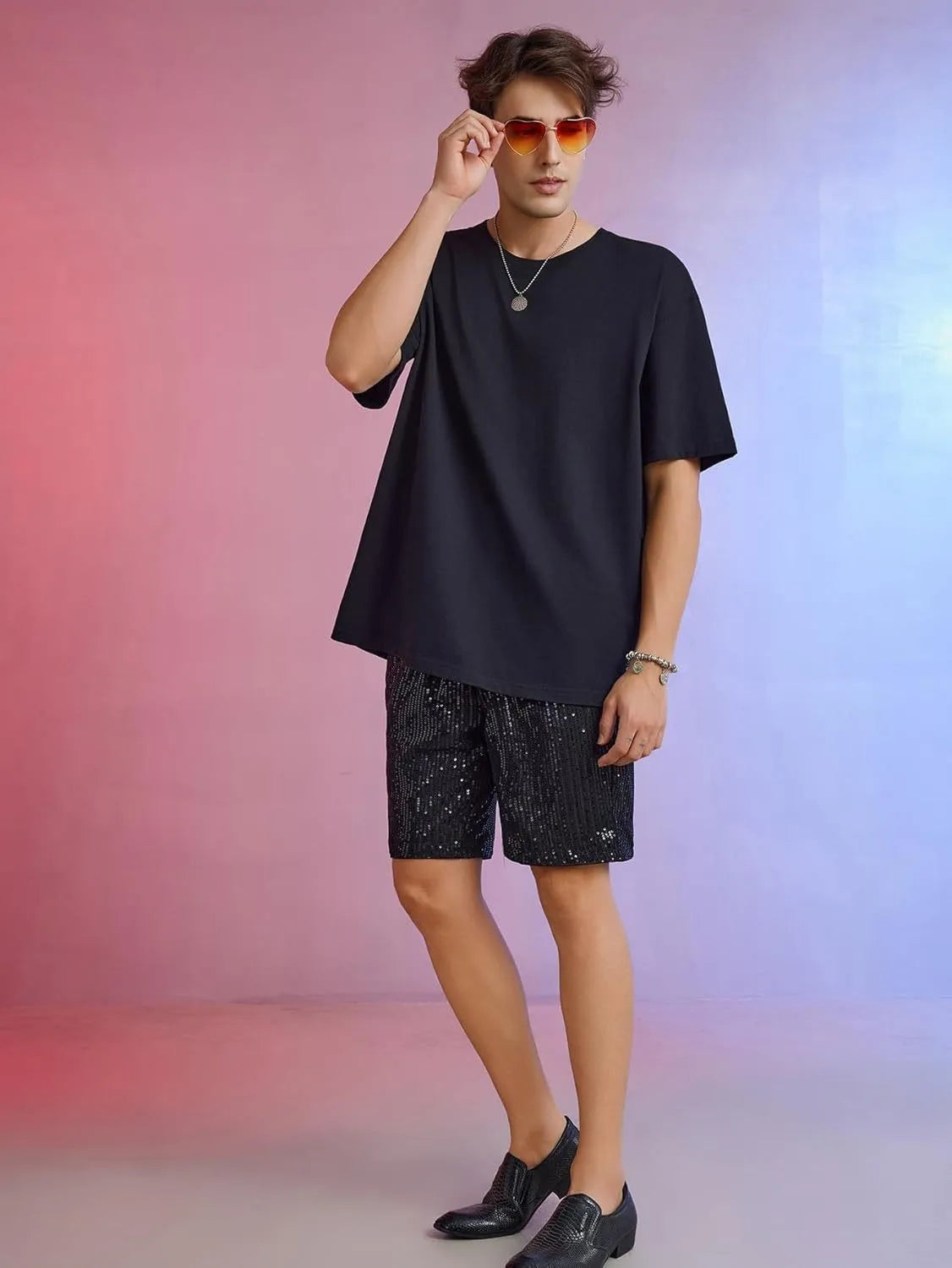 Men's silver sequin shorts with straight cut design and elastic waistband