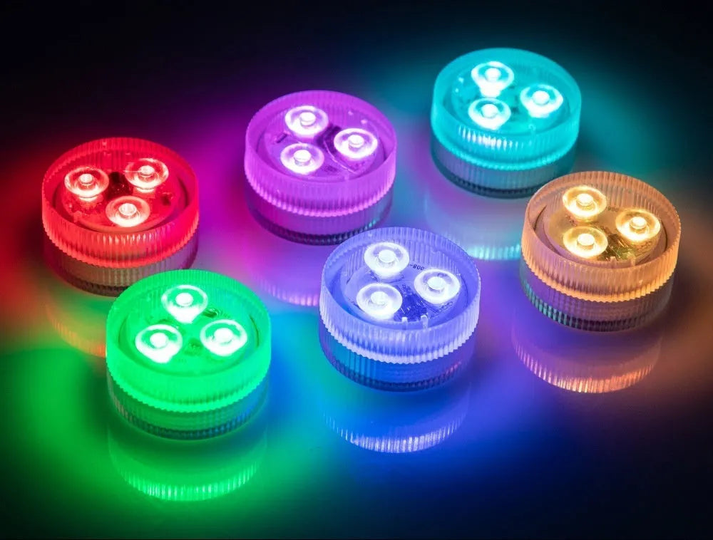 Compact white plastic remote control LED diving light for aquarium, shown with remote.