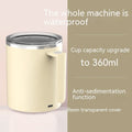 White automatic stirring coffee cup with rechargeable base on a table.