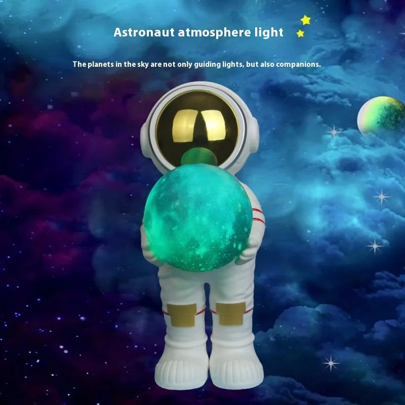 Spaceman starry sky projection lamp with astronaut holding moon design in fantasy painted finish