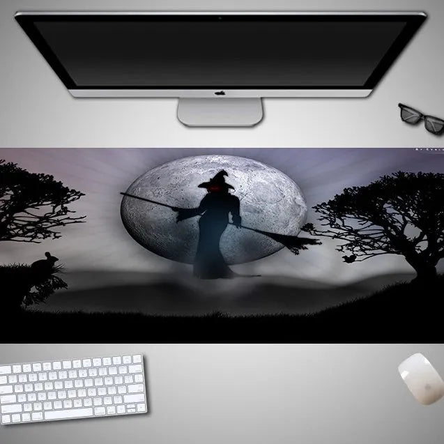 Oversized Halloween-themed gaming mouse pad with non-slip rubber base on a desktop