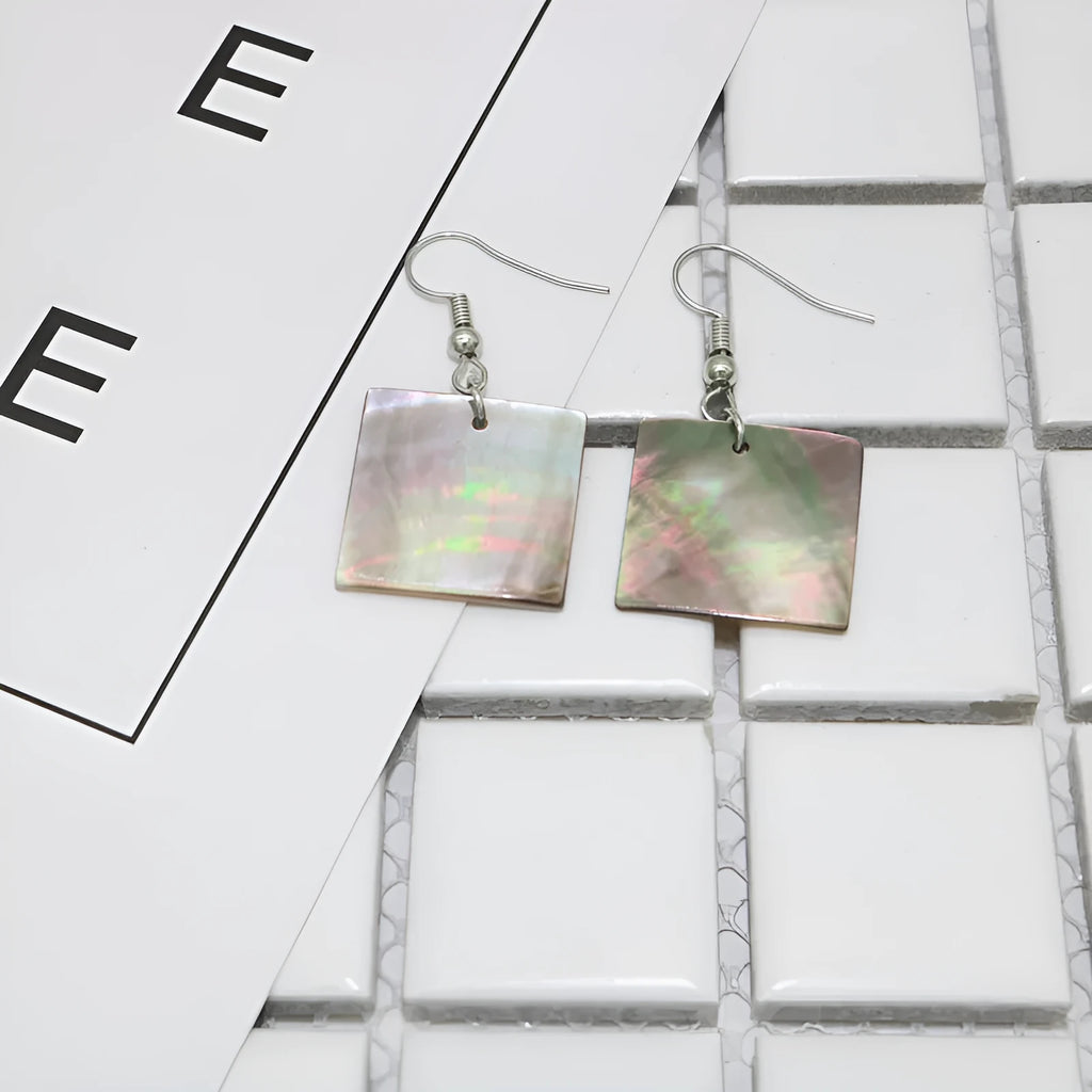 Women's geometric shell earrings showing rectangular and square shapes with natural shell material texture
