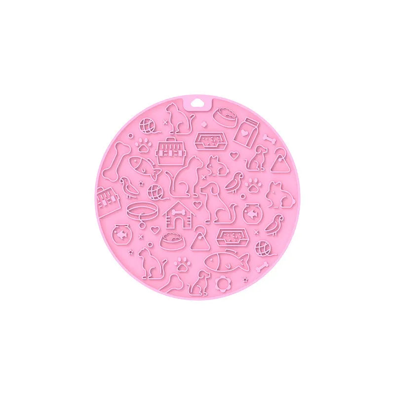 Round silicone pet licking mat with textured surface and a central suction cup, shown in mint green colour.