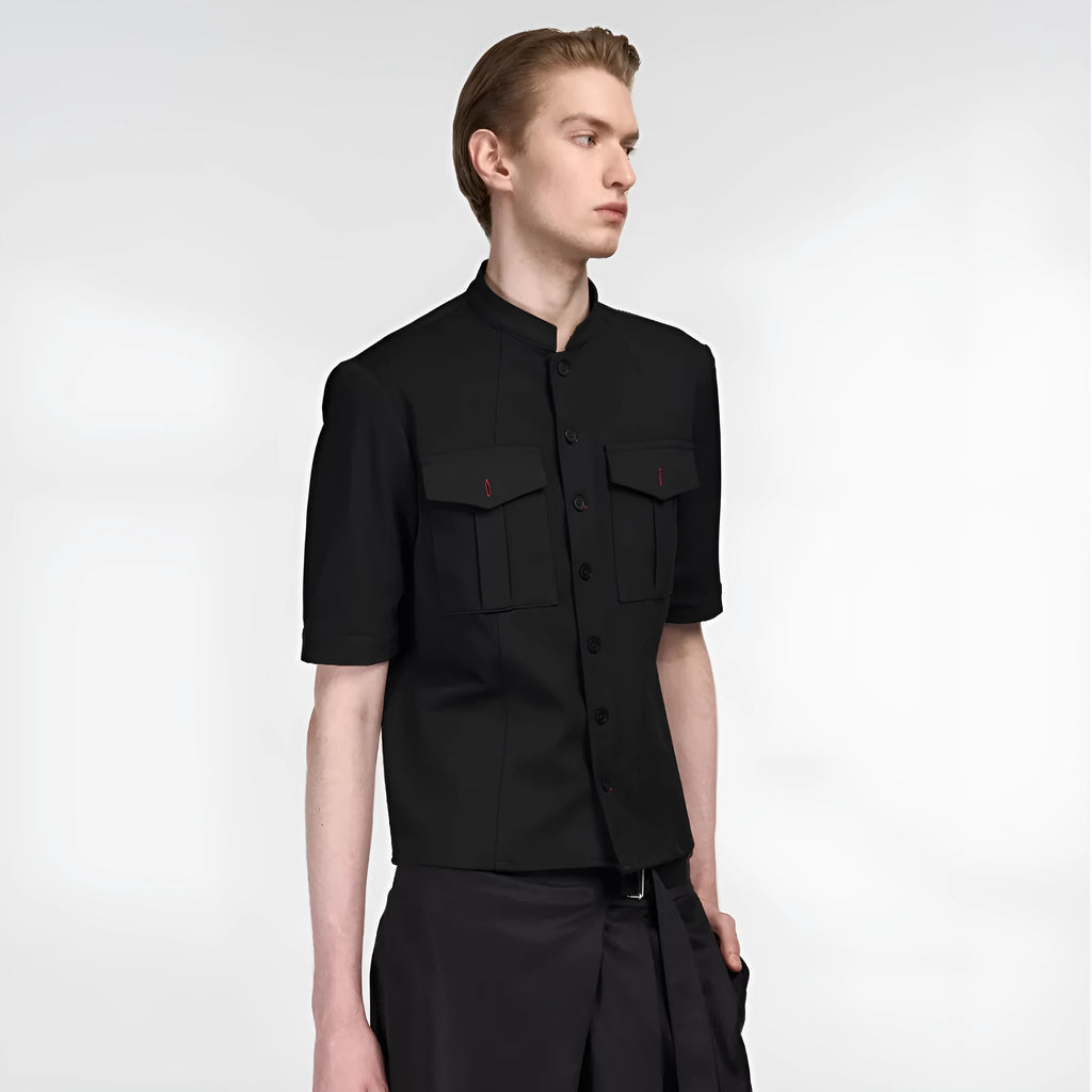 Black handmade loose-fit half sleeve hunting shirt with a shirt collar on a hanger.