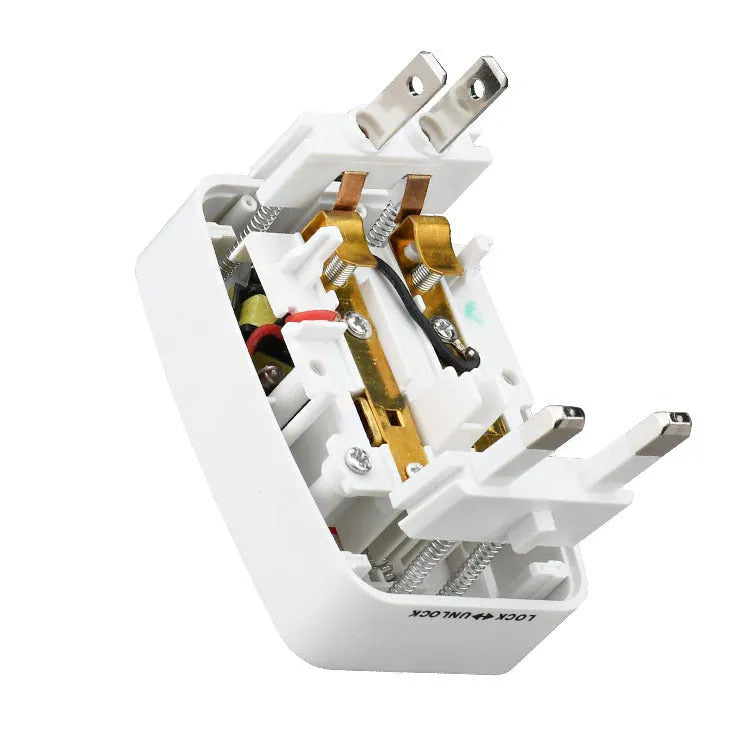 White universal travel plug adapter with dual USB ports and interchangeable UK EU US AU plugs on a plain background