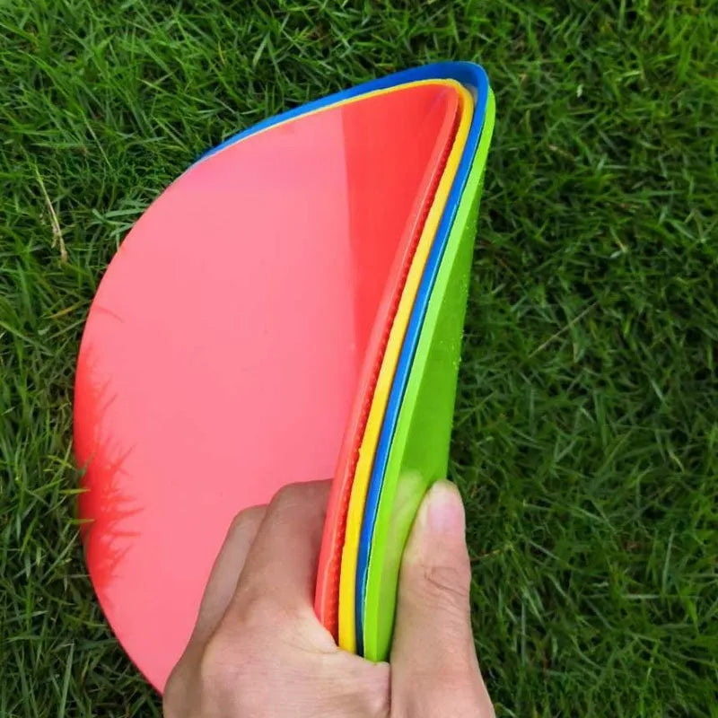 Soft circular football training target pad in bright colours measuring 23cm across