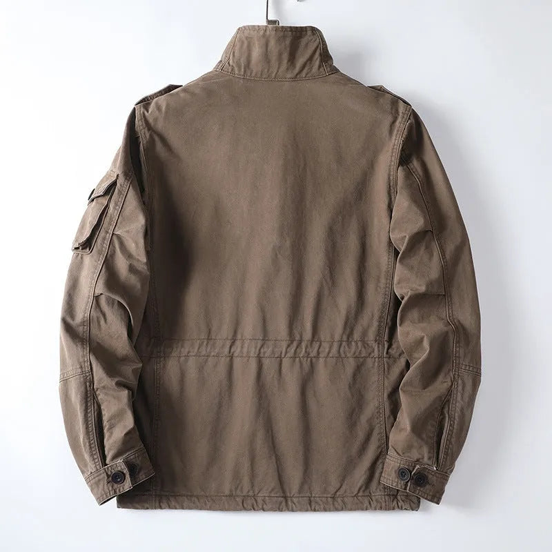 Men's loose-fit casual cotton jacket in light brown with zip front, shown on a model.