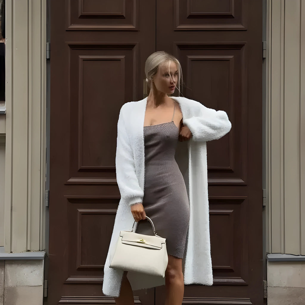 Long white women's cardigan jacket with thick knit and open front.