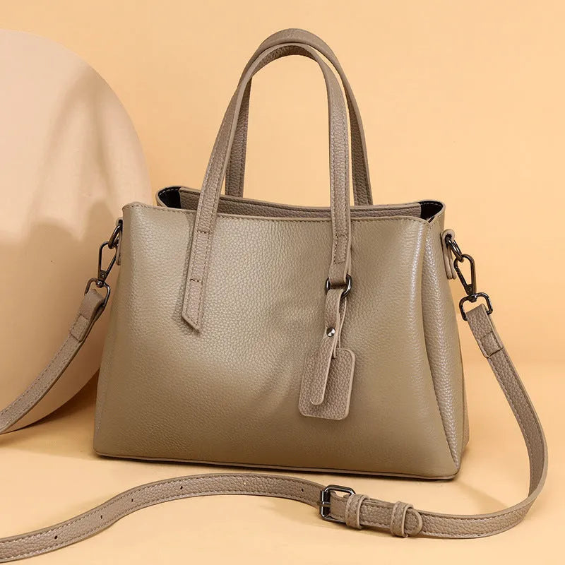 Cowhide leather women's shoulder handbag in khaki with multiple compartments and business styling