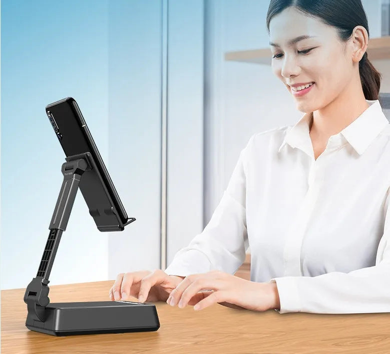 Black mobile phone broadcasting stand with Bluetooth speaker and microphone on desk