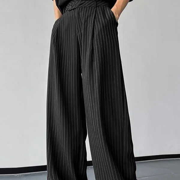 Men's black vertical striped pleated casual trousers showing elastic fabric detail