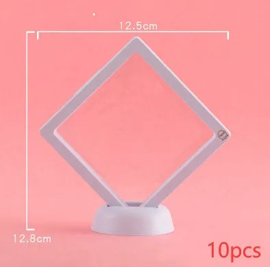 3D floating display case holding coins and jewellery between transparent membrane sheets