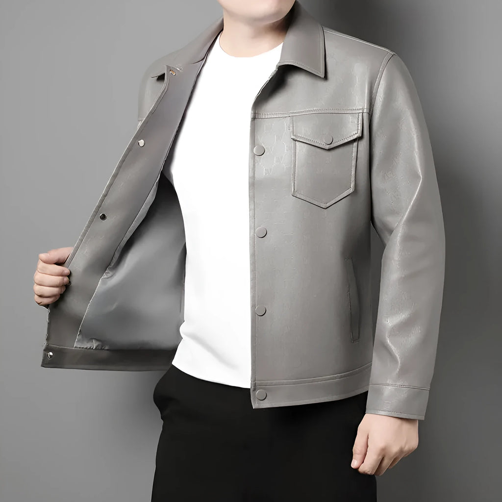Men's slim fit printed synthetic leather jacket with lapel collar, straight hem, and top stitch patch pocket in black or light grey