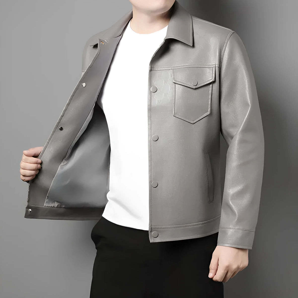 Men's slim fit printed synthetic leather jacket with lapel collar, straight hem, and top stitch patch pocket in black or light grey