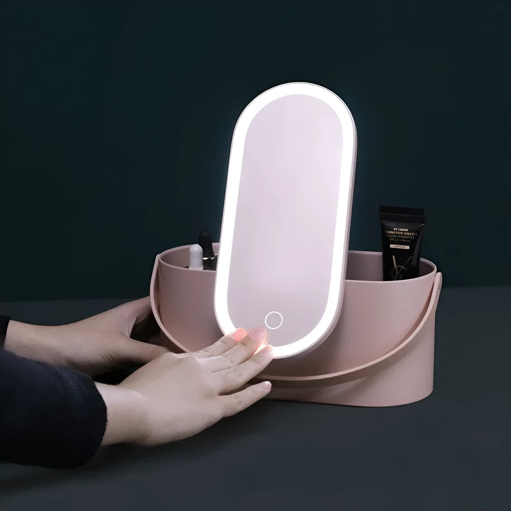 Pink portable makeup storage box with LED illuminated aluminium mirror and cosmetic compartments