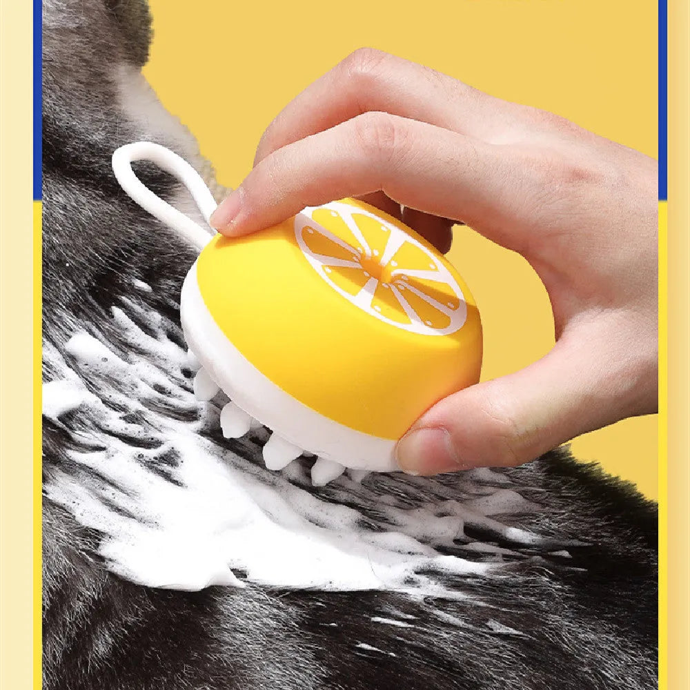 Yellow silicone pet bath brush with massage bristles and a combed grooming section on a single handle.