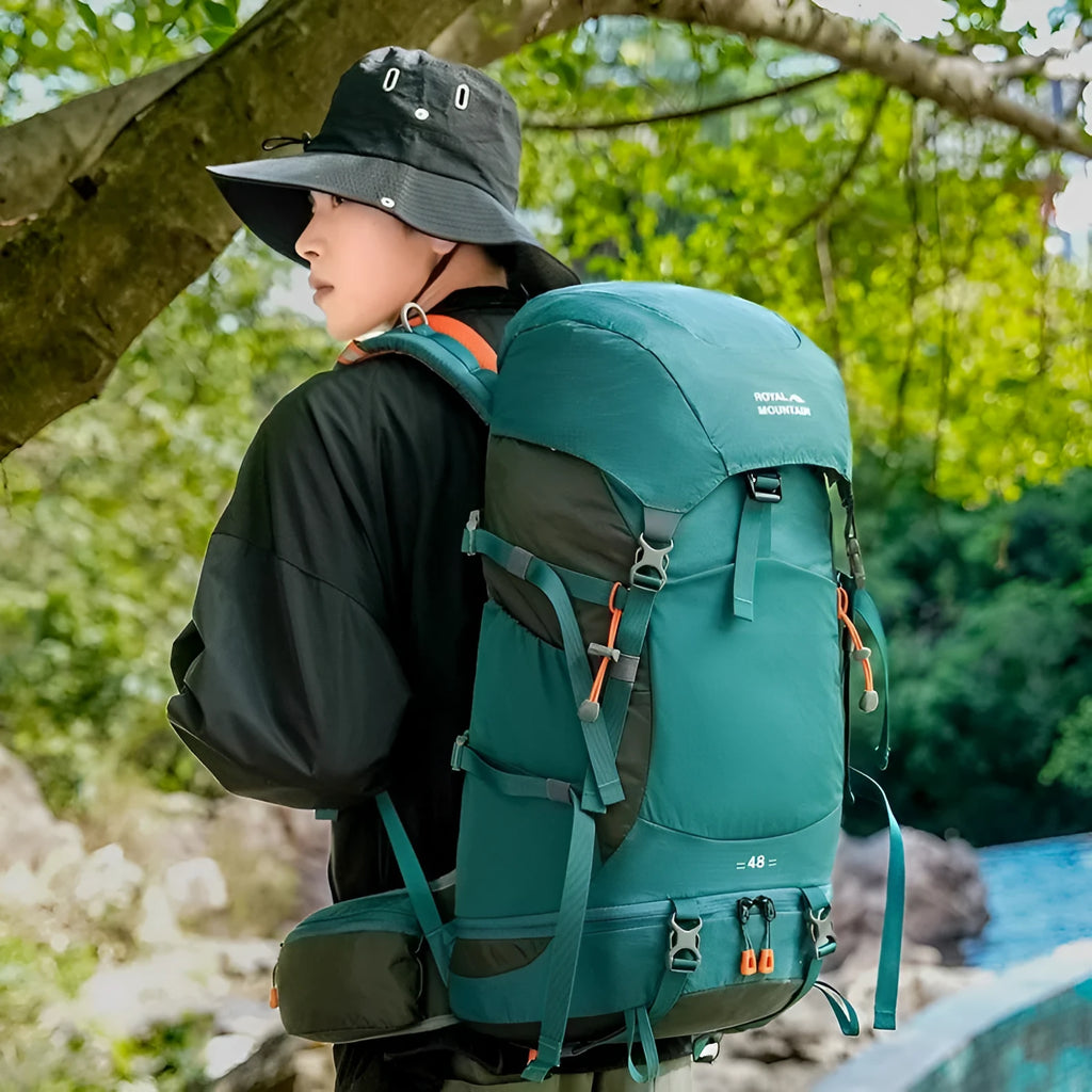 35L nylon hiking backpack in green colour with front zip pocket and compression straps for outdoor use