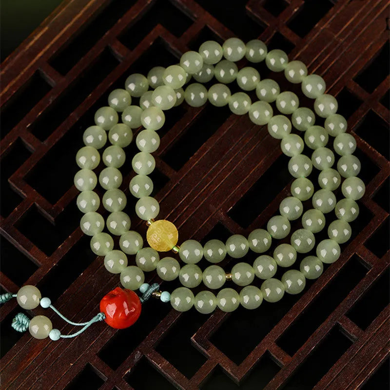 Pale blue Hetian jade bracelet with three circle design on wrist