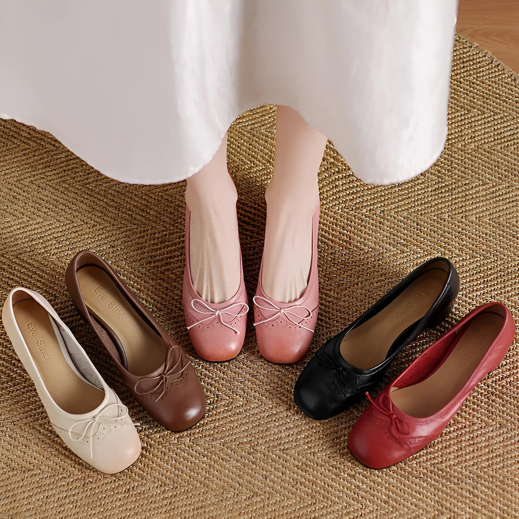 Women's round toe mid heel chunky leather pumps in solid colour with bow detail
