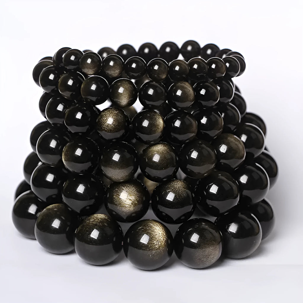 Hand-woven obsidian bracelet with round crystal beads in black stone variations including rainbow eye obsidian