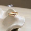 Golden electroplated stainless steel heart ring with oval design elements in women's sizes 5-8